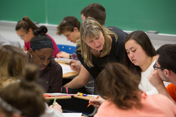 Instructor helping students